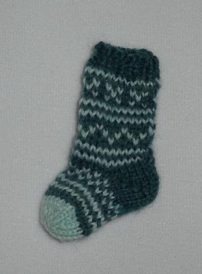 Miniature Sock - facing left
<p>Here's another view of the miniature sock.</p>
Keywords: knitting