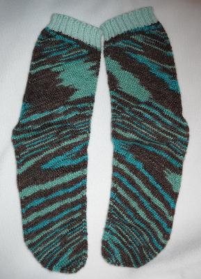 Striped Socks - front
<p>I was blown away by these, too. These are striped <strong>mirror images</strong>! The color isn't murky like in these pics...it's called Aloha Multi, and it reminds me of Hawaii!</p>
Keywords: knitting
