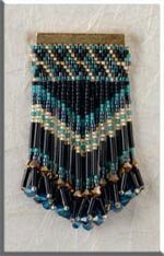 Jeweled beaded bar pin
I made this for a class I was teaching.  This is the manufacturer's (Mill Hill) photo, as mine didn't turn out.  I don't own this one, as it was the property of the store which held the class.  This is made in peyote stitch.
Keywords: beading