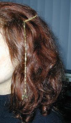 Hair ornament
A simple stringing design and beaded bobby pin.  I made this in a moving car.  The charm is a comedy/tragedy mask design.  It's held on with a lobster claw, so it can be switched out as needed.
Keywords: beading