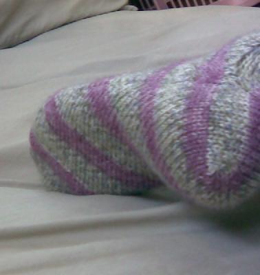Skew socks- v3
<p>This is the outside of the left heel. There's some kitchener stitch in the&nbsp;center of the greenish splotchy&nbsp;section inside the rose-colored loop at the far right of the photo.&nbsp; Does that make any sense??&nbsp; :-)</p>
Keywords: knit