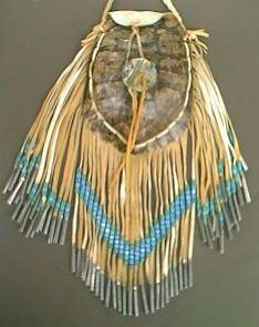 Turtle purse
I did not make the actual purse but I added the beads and cones seen here. This is part of my women's traditional dance regalia.
