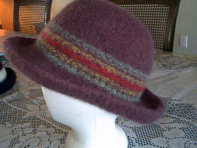 Experiment hats
Second view of the brown, green, red, gold
Keywords: felted hats