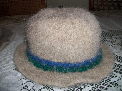 Two rows of bobbles
<p>Getting creative with hat band area.&nbsp; The blue and green are just bobbles knit into the fabric.</p>
