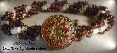 Purple Joy
Spiral Stitch with antique style bohemian button clasp.
Keywords: bracelet