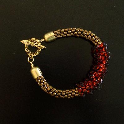 Bronze and Rust Kumihimo Bracelet
<p>This bracelet has bronze seed beads on both ends, with rust drops in the center.</p>
Keywords: kumihimo bronze rust bracelet
