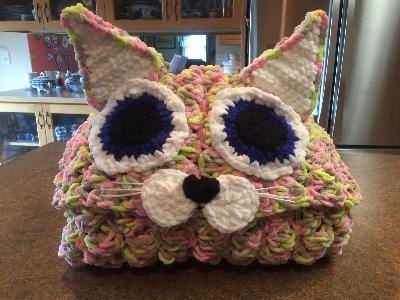 Hooded Cat Blanket
<p>Everyone loves these hooded animals. I have made so many blankets like this in the form of an owl, wolf, fox, parrot, and cat. Can't remember the latest one, but I did purchase the pattern. Oh yes... it is a skunk! I made some for our pastor's kids so they use them during the winter to wrap up in. The pattern says to use double strands. Well, why do that when there is Bernat Blanket Yarn! I love that yarn! It works up quickly and you can use 3 - 4 skeins of the large skeins to make it. Depending on size of child.</p>
Keywords: blankets